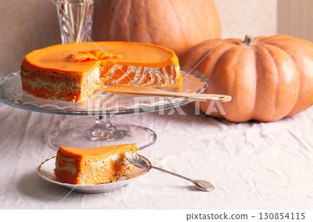 Homemade cottage cheese and pumpkin striped casserole with poppy seeds and orange and cut piece and pumpkins Homemade cottage cheese and pumpkin striped casserole with poppy seeds and orange and cut piece and pumpkins 130854115