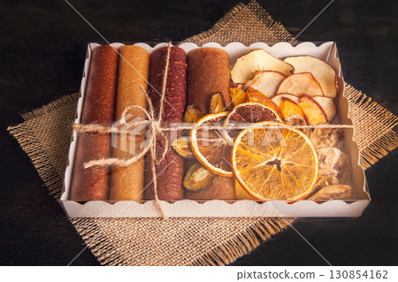 Sweet fruit snacks in a package - pastilles and dried fruit. Sweet fruit snacks in a package - pastilles and dried fruit. 130854162