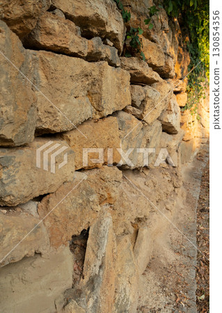 Antique beautiful stone wall Antique beautiful stone wall 130854356