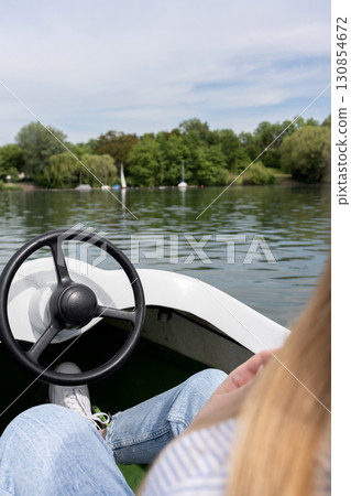 A girl is sailing on a yacht A girl is sailing on a yacht 130854672