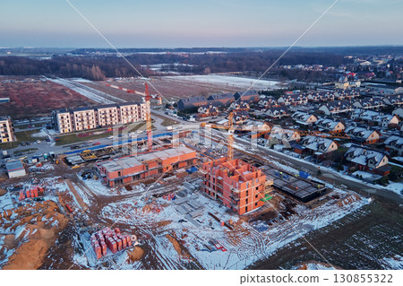 Construction site with cranes and new buildings 130855322