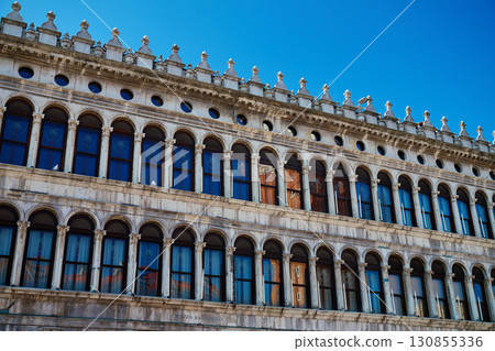 Historic building facade with arched windows in Piazza San Marco Venice 130855336