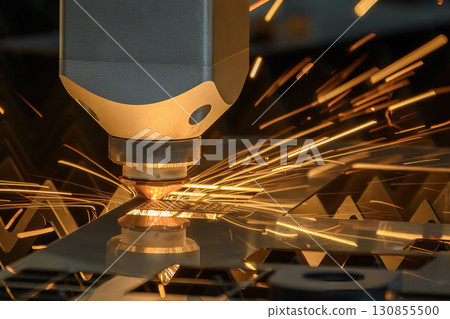 Close up scene the fiber laser cutting machine cut the metal plate control by CNC program. 130855500