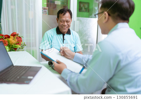 Patient Consultation with Healthcare Professional in Modern Clinic Setting Patient Consultation with Healthcare Professional in Modern Clinic Setting 130855691