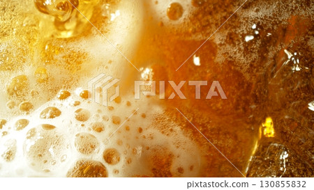 Macro Shot of Pouring Beer Drink , abstract background 130855832