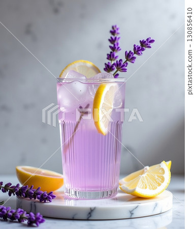 Refreshing Lavender Lemonade Glass with Ice Cubes and Garnish Still Life 130856410