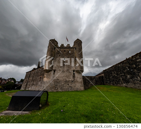 Enniskillen Castle is standing on the banks of Lough Erne in Northern Ireland. Dramatic clouds 130856474