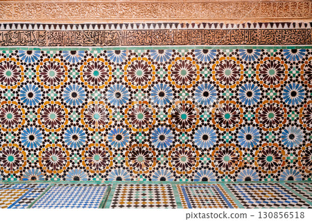 Moroccan zellij tilework showcases intricate geometric patterns and Arabic calligraphy, reflecting rich cultural heritage. Moroccan zellij tilework showcases intricate geometric patterns and Arabic calligraphy, reflecting rich cultural heritage. 130856518
