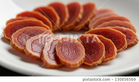 Sliced Red Ginseng Root on White Plate Sliced Red Ginseng Root on White Plate 130856569