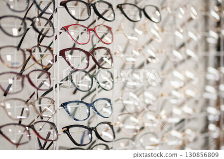 Many different stylish glasses on light grey background, flat lay 130856809