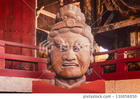 Wooden Nio guardian head inside Todai ji Temple Nara Japan showing fierce Buddhist protective deity Wooden Nio guardian head inside Todai ji Temple Nara Japan showing fierce Buddhist protective deity 130856850