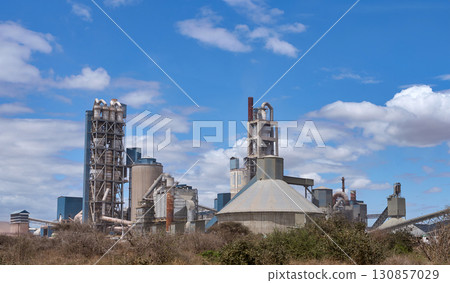 A cement factory towering against the blue sky of Kenya A cement factory towering against the blue sky of Kenya 130857029