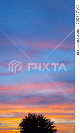 Bright sunset sky 130857162