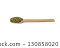 Dried leaves o Lemon verbena in latin Aloysia citrodora on wooden spoon isolated on white background. Medicinal. herb. 130858020
