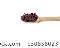 Dried beetroot slices on wooden spoon isolated on white background. 130858023