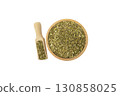 passion flower herb in latin - passiflora incarnata in wooden bowl and scoop isolated on white background. Medicinal herb. 130858025