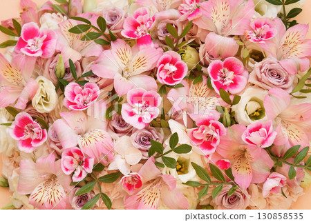 Blossoming pelargoniums and alstroemerias, spring flowers festive background, bright springtime bouquet floral card, selective focus Blossoming pelargoniums and alstroemerias, spring flowers festive background, bright springtime bouquet floral card, selective focus 130858535