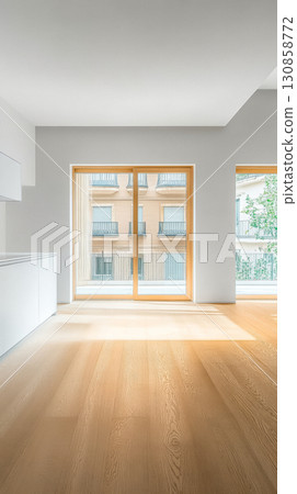 Modern interior design featuring large windows and natural light in a spacious living area 130858772