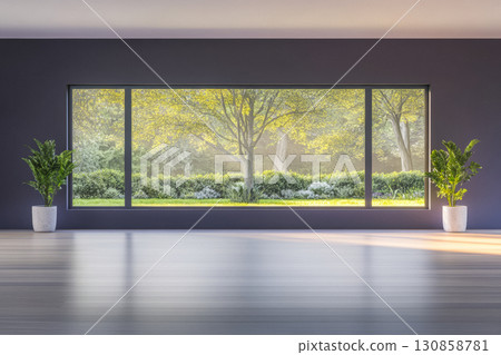 Bright and serene interior showcasing large windows with a view of a lush garden in a modern space 130858781