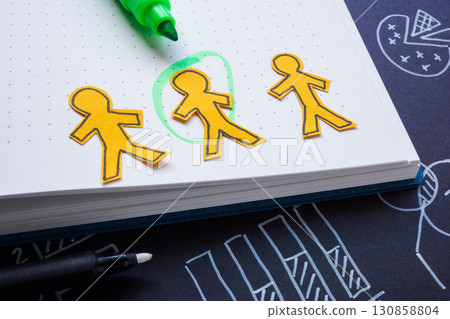 Highlighted employee among colleagues. Symbol of recruitment or leadership. Highlighted employee among colleagues. Symbol of recruitment or leadership. 130858804