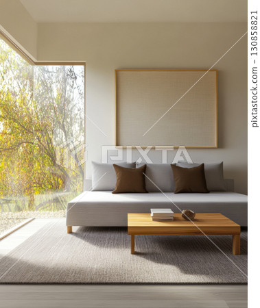Bright modern living room with large windows offering views of trees and natural light 130858821
