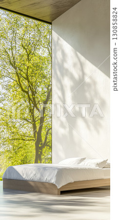 Peaceful bedroom with a view of lush greenery on a sunny afternoon 130858824