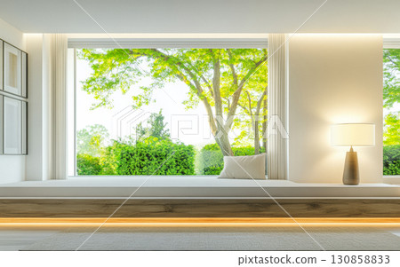 Modern interior design featuring a cozy window seat with natural light and greenery in the background, creating a serene atmosphere Modern interior design featuring a cozy window seat with natural light and greenery in the background, creating a serene atmosphere 130858833