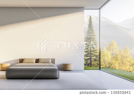 Modern bedroom with expansive windows showcasing mountain views and natural light in a serene setting 130858841