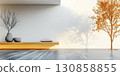 Modern interior design featuring minimalist furniture and a tree shadow in a bright space 130858855