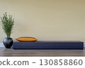 Modern living space with minimalist furniture and decorative plant in warm tones 130858860