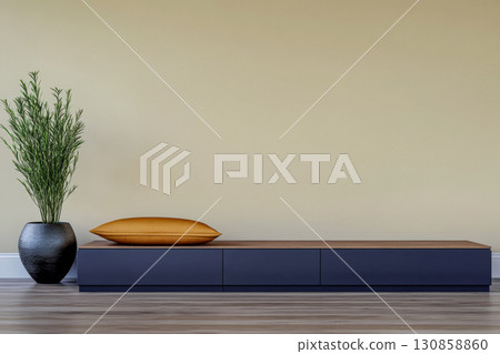 Modern living space with minimalist furniture and decorative plant in warm tones 130858860