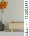 Minimalist interior design featuring a wooden bench and a decorative plant in warm hues 130858862