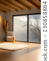 Cozy interior of a modern room with large windows overlooking a misty landscape and stylish decor 130858864