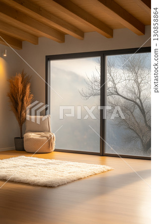 Cozy interior of a modern room with large windows overlooking a misty landscape and stylish decor 130858864
