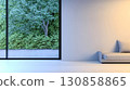Modern interior design featuring a large window with a lush green view in a contemporary living space 130858865