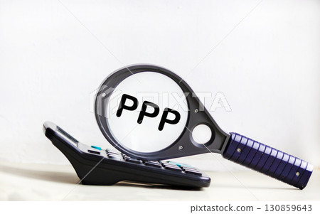 PPP is a word on a magnifying glass and on the background of a light board with beautiful streaks.  130859643