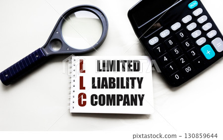 LLC is a limited liability company. A notebook with the word OOO. Business concept and LLC. LLC is a limited liability company. A notebook with the word OOO. Business concept and LLC. 130859644