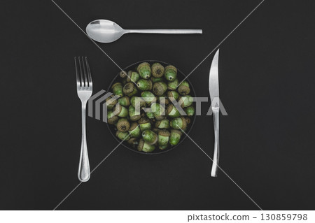 Abstract background dish of oak tree acorns Abstract background dish of oak tree acorns 130859798