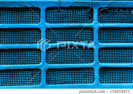 Background surface of blue and damaged metallic grid 130859855