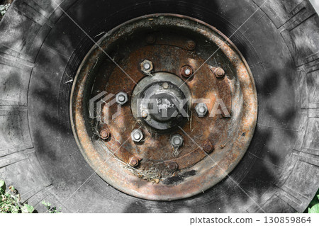 Background Surface of Old and Dirty Tire with Rusty Disc Background Surface of Old and Dirty Tire with Rusty Disc 130859864