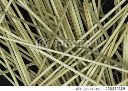 Messy looking background of natural bamboo skewers 130859889