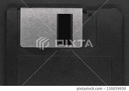 Black floppy disk on black background Black floppy disk on black background 130859930