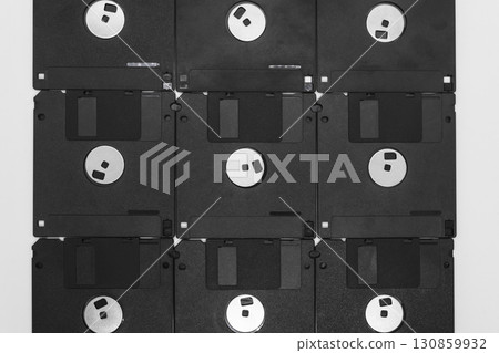 Background of black floppy disks on white background 130859932