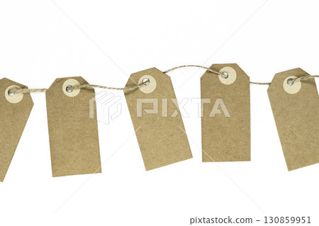 Blank brown note cards with copy space stuffed on brown rope like garland and isolated on white background 130859951