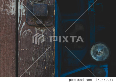 Blue tractor and barn gate doors 130859955