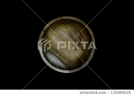 Brown bowl made from palm tree wood and isolated on black background Brown bowl made from palm tree wood and isolated on black background 130860026
