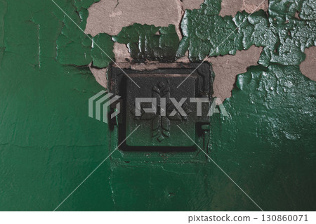 Concrete stove with closed metal doors 130860071