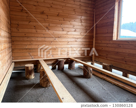 Construction of a house from rounded logs. Ecological house. High quality photo Construction of a house from rounded logs. Ecological house. High quality photo 130860128