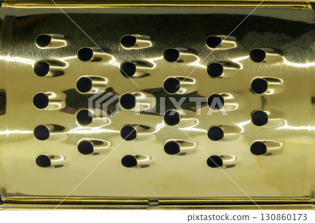 Golden hand grater background 130860173
