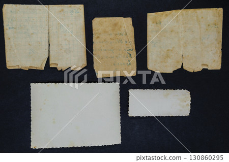 Old and Aged Document and Photo on Black Background Surface 130860295